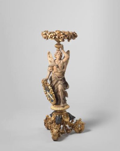 Guerdon in the form of an angel figure in drapery, with a volute-shaped tripod and boar's heads