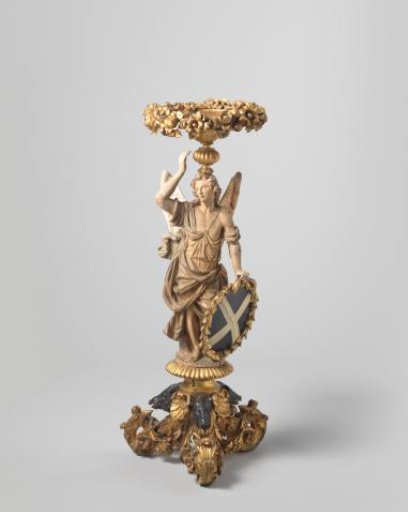 Gueridon in the form of an angelic figure with drapery on a volute-shaped tripod with boar's heads