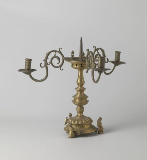 Candlestick on three legs in the form of sirens