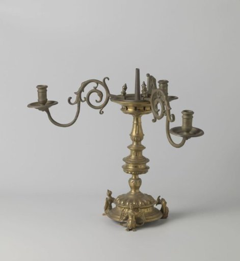 Candlestick on three legs in the form of sirens