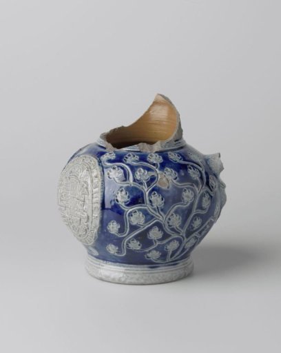 Fragment of a jug with coat of arms and floral scrolls