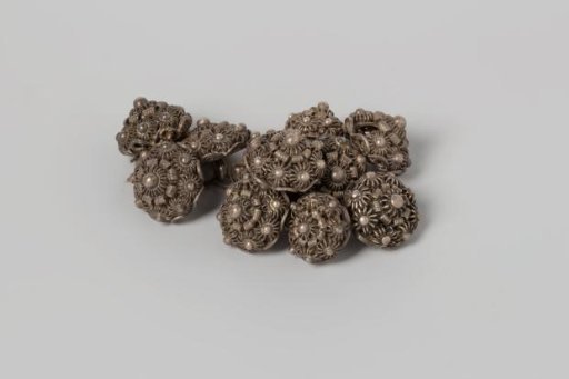 Eleven silver buttons