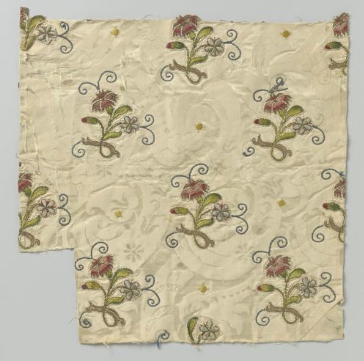 Fragment of silk damask with embroidered flower branches