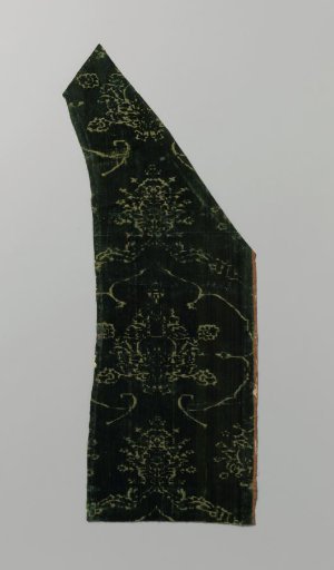 Fragment of green silk velvet with pomegranate motif