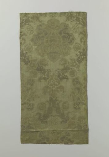 Fragment of green damask brocade with pomegranate motifs