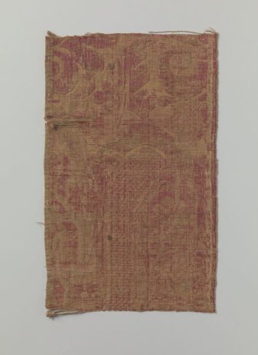 Fragment of yellow and red silk brocatelle with a pattern of floral ornaments flanked by vases