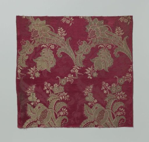 Fragment of Carmine-Red Damask with Gold-Colored Silk Weave Featuring a Pattern of Stylized Leaves and Flowers with Curved Tassels of Flowers, Leaves, and Fruits