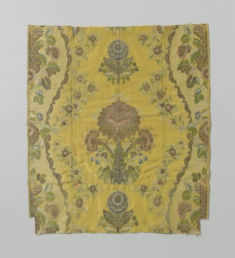 Fragment of five joined yellow silk tables with a pattern of a bouquet surrounded by floral garlands and loose flowers, with a broad band undulating around them
