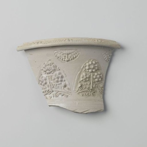 Fragment of a flower pot with floral scrolls