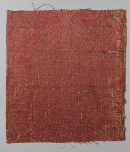 Fragment of red linen and silk, so-called brocatel, with a stylized floral motif with a vase-shaped foot and surrounded by stylized leaves