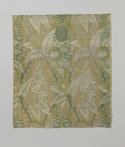 Fragment with a pattern of branches bending toward each other with leaves and fruit on a finely ornamented ground