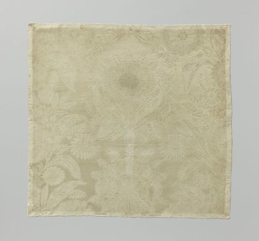Fragment of white silk damask with a pattern of marigolds surrounded by festoons of flowers and leaves