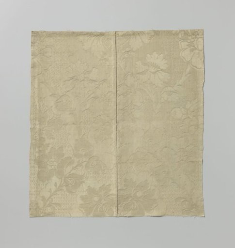 Fragment of white silk damask with a pattern of scaled ground with floral and leafy branches