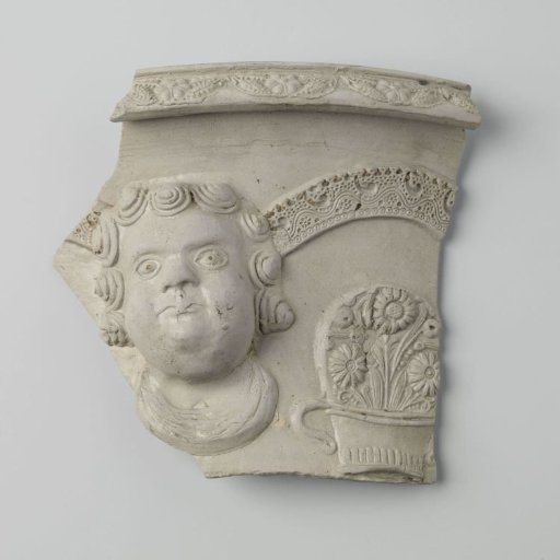 Fragment of a flower pot with the head of a child