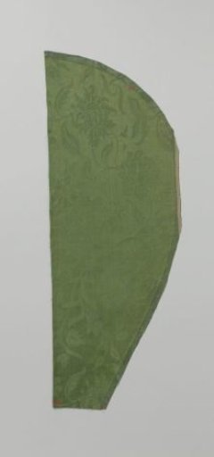 Fragment of green silk damask with a pattern of winding vines with stylized leaves, lilies, and roses