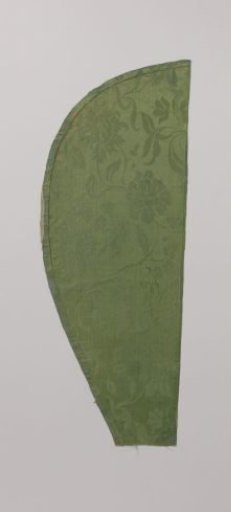 Fragment of green silk damask with a pattern of winding vines with stylised leaves, lilies and roses
