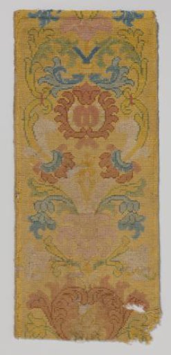 Border of yellow woolen fabric with colored flowers