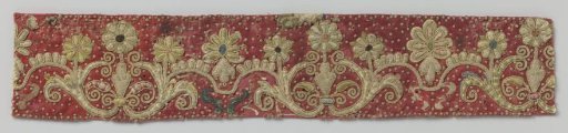 Fragment of Embroidery on a Red Weave