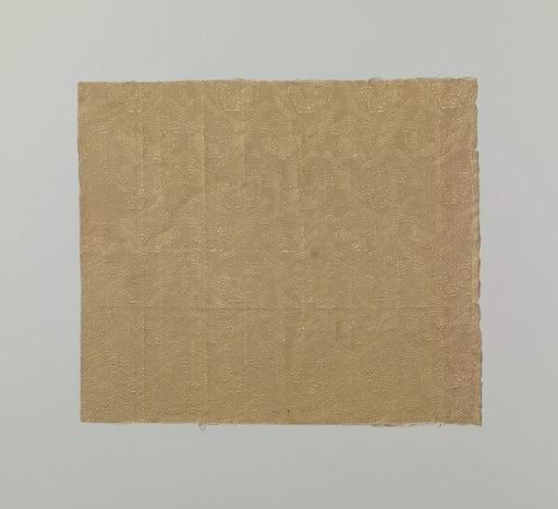 Fragment of yellow silk fabric with a yellow pattern