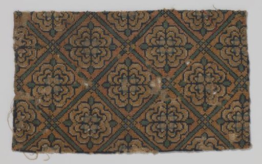 Gauze, fragment, with green squares containing a rosette on a yellow-brown background