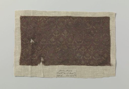 Fragment of silk fabric with motif of stylized foliage