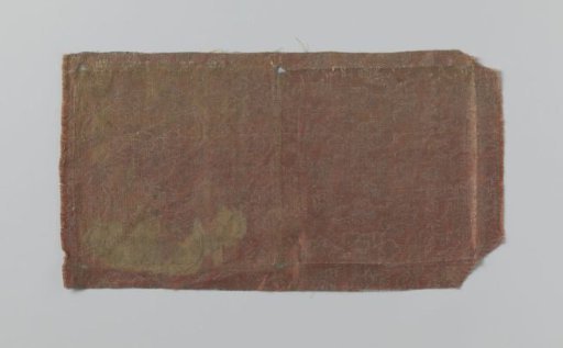 Fragment of red silk satin with floral motif in silver lamé