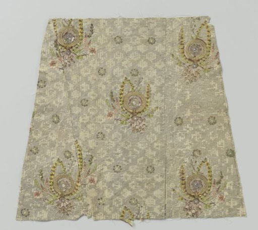 Textile, fragment, white with silver and gold thread with woven stars and flowers