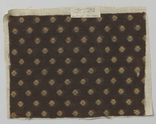 Fragment of coarse linen fabric with blue, white, and dark brown knots