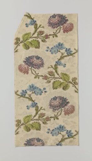 Fragment of white brocaded silk
