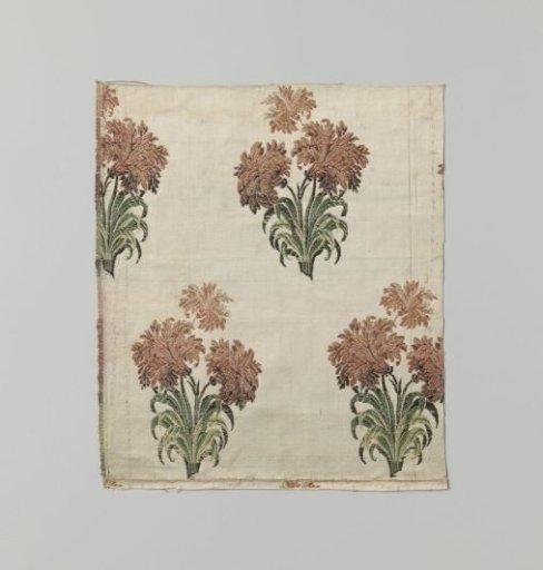 Fragment of white silk satin with multicolored flowering branches