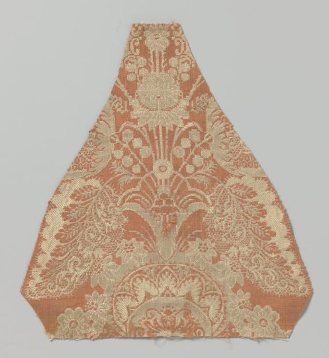 Fragment of salmon-colored silk with a palmette pattern