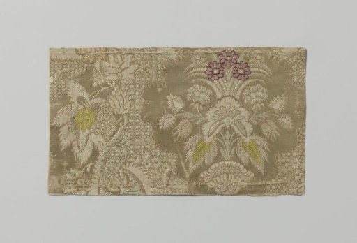 Fragment with a pattern of a flower vase and grapevine