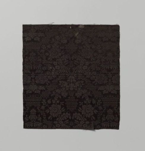 Fragment of black silk damask