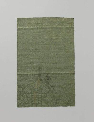 Fragment of green silk damask
