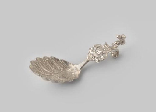 Sugar spoon with a curved handle featuring a dancing Amor