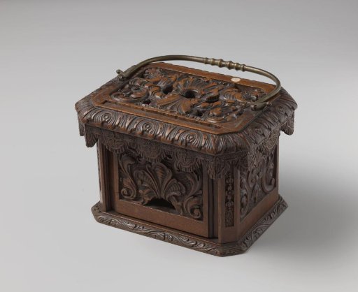 Stove, richly carved with a copper handle