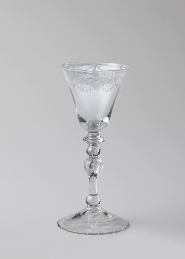 Chalice glass with an ornamental border