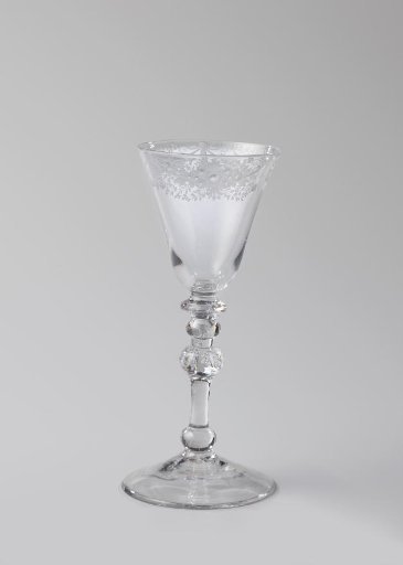 Chalice glass with an ornamental border