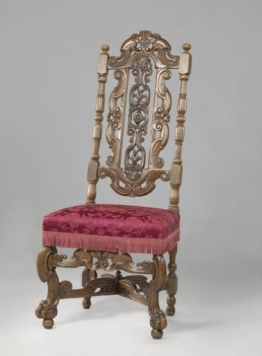 Chair with front legs set diagonally, X-shaped cross and upholstery of morocco leather with floral pattern