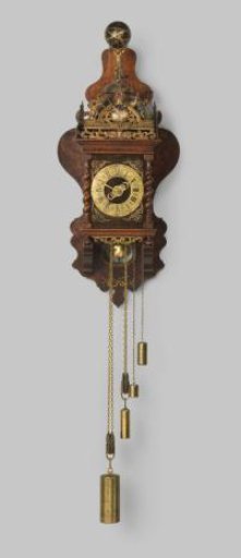 Wall clock with profiled foot and cornice and swagged corner stiles, against a vase-shaped leaf