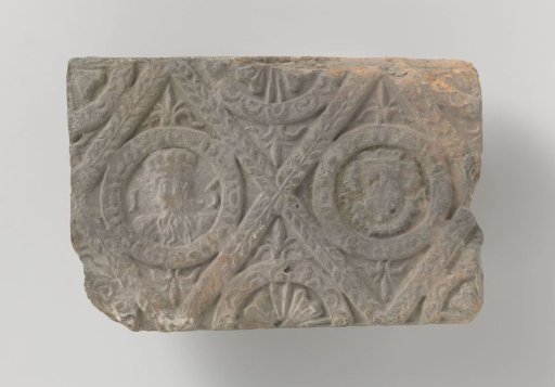 Chimneypiece with a representation of imperial heads, set in two profiled panels