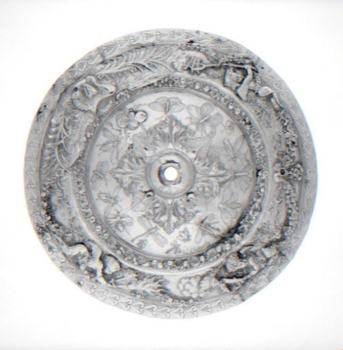 Plate decorated with chased floral garlands and putti