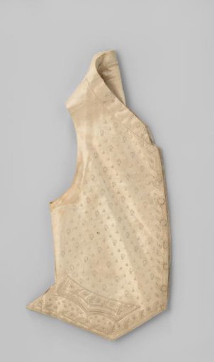 Waistcoat of cream silk, embroidered in cream with a scattering motif of tassels and garlands and a border motif of foliate scrolls, with detached flowers in between.