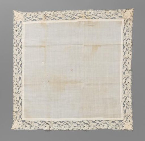 Linen chalice cloth with a border of bobbin lace with rosette flowers on wavy vines