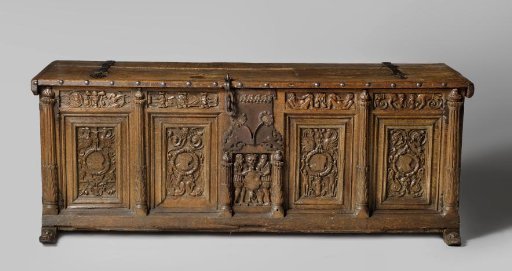 Chest whose front panel is decorated with grotesques grouped around medallions with heads, within laurel wreaths