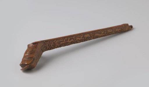 Pipe holder of palm wood, carved with a hunting scene