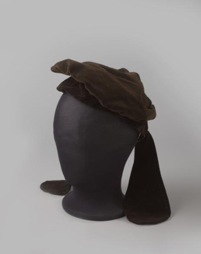 Peasant's Cap of Brown Velvet with Broadly Flaring Rounded Flaps