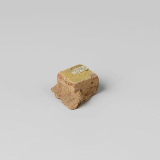 Tile with yellow glaze