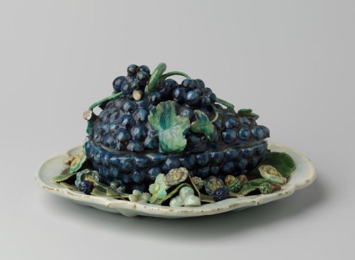 Lid of a butter dish in the shape of a blue grape cluster