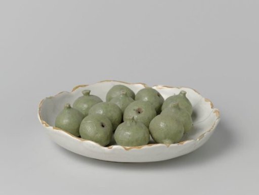 Plate with a scalloped rim and twelve applied figs